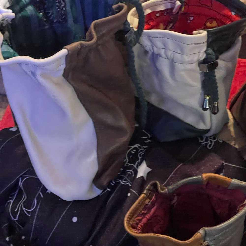 Large handmade leather bags. Holds from 12-18 ounces, made from leather scraps.